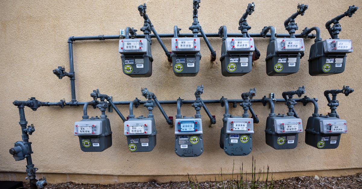 a neat installation of gas meters mounted on an exterior wall in an urban setting